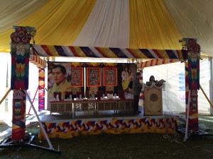 Panellists are flanked by the 4th and the 5th king of Bhutan at the podium.